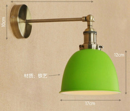 Green dome-shaped wall lamp with adjustable arm, iron material.