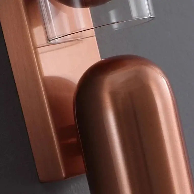Copper-finished bedroom wall reading lamp with adjustable curved design and clear glass accent for wall reading use