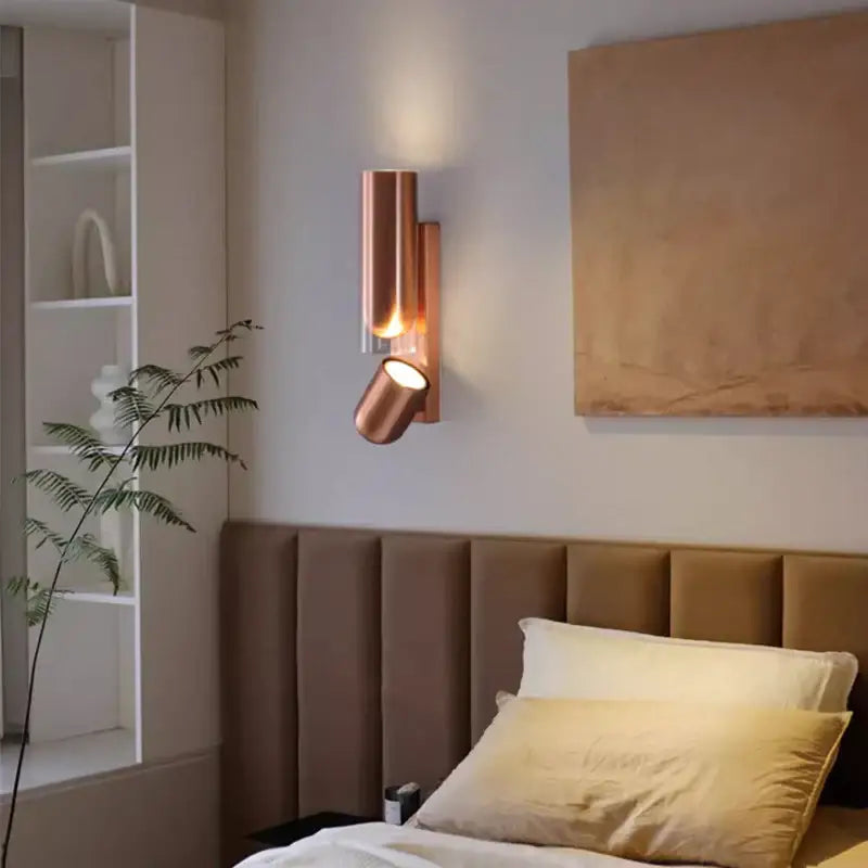 Copper-toned cylindrical wall reading lamp with adjustable spotlight for bedroom wall reading lamps use