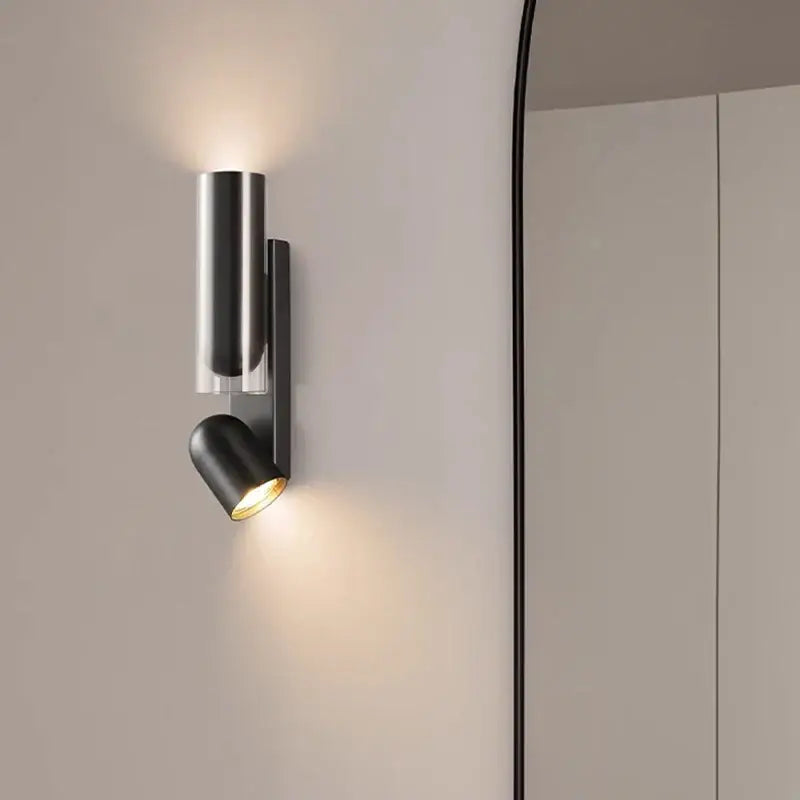 Modern black cylindrical bedroom wall reading lamp with adjustable spotlight and sleek minimalist design for wall reading