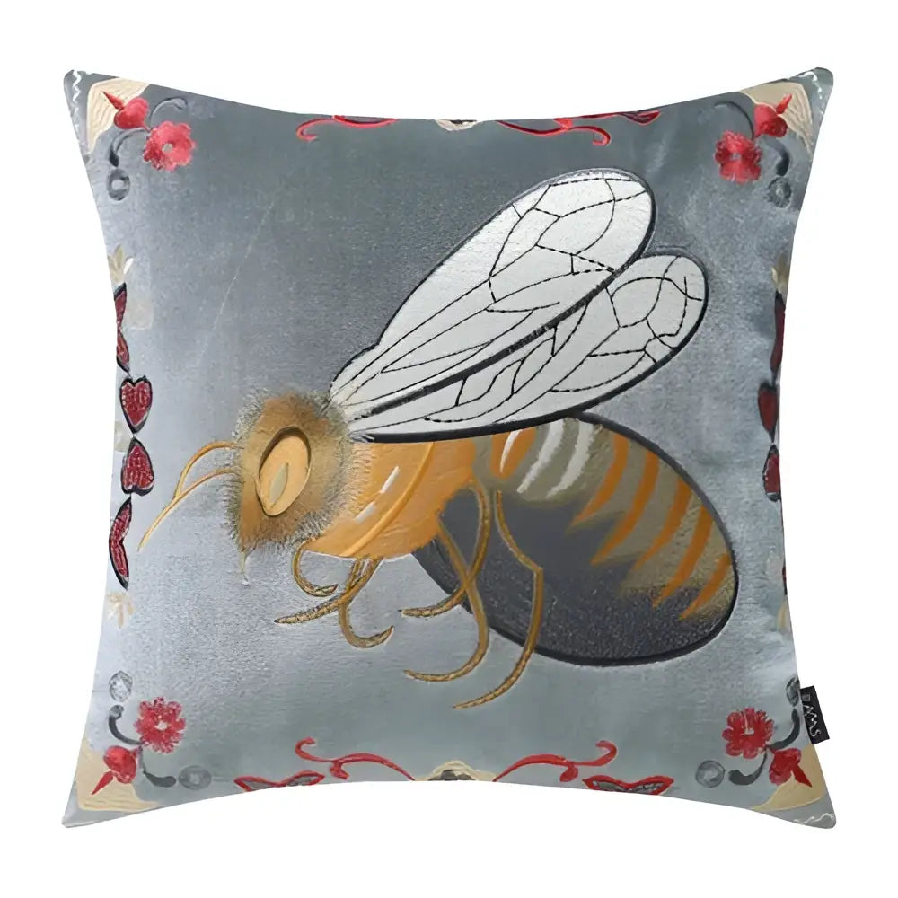 A plush gray velvet bee embroidery cushion cover with golden stripes and floral accents for living room decor