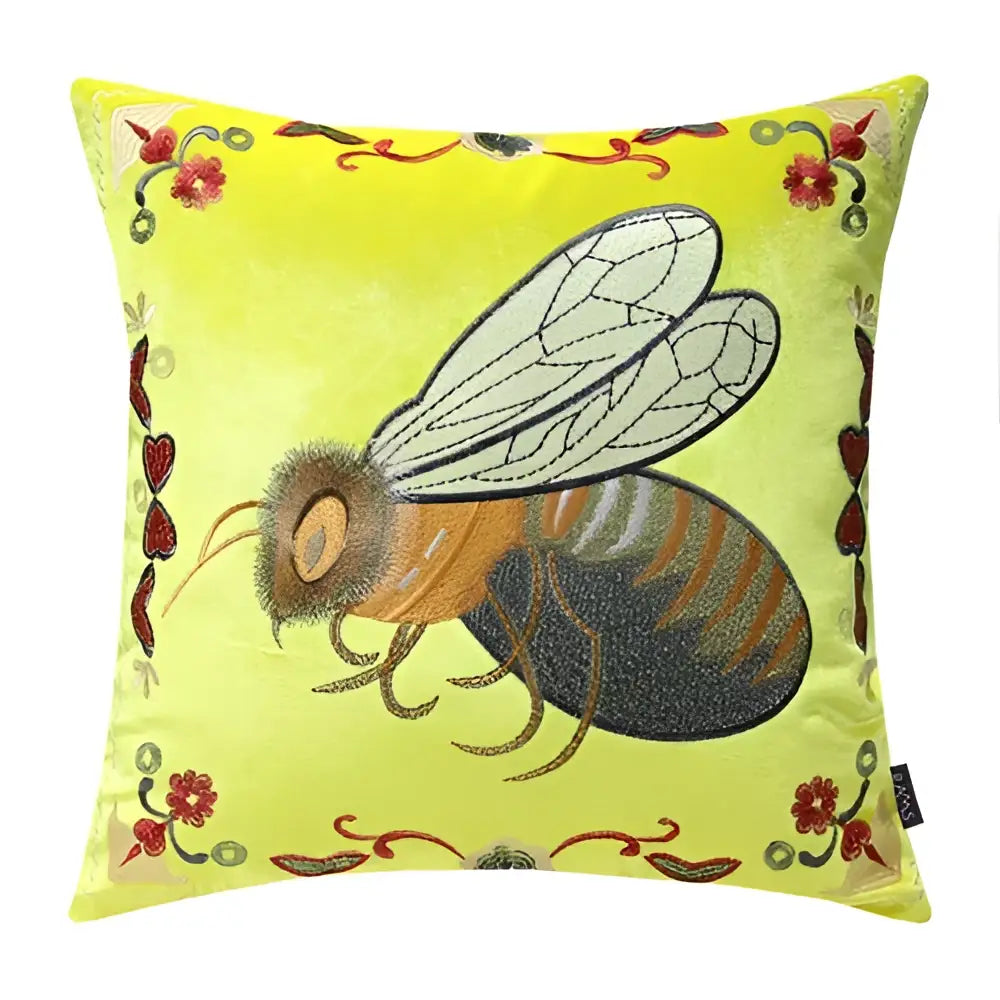 A yellow velvet bee embroidery cushion cover with orange and black stripes and floral accents for living room decor