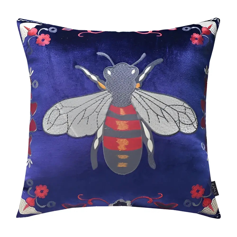 A navy blue velvet bee embroidery cushion cover with silver wings and floral accents for living room decor