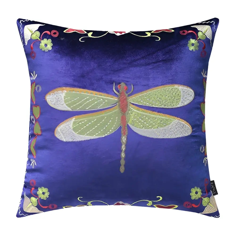 A royal blue velvet cushion cover with green and silver embroidered dragonfly and floral accents for living room decor
