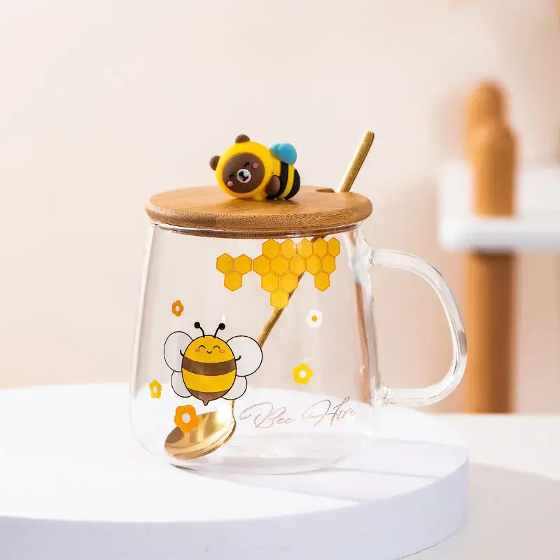 Bee glass spoon milk cup featuring a clear glass mug with bamboo lid cartoon bee design and golden spoon inside