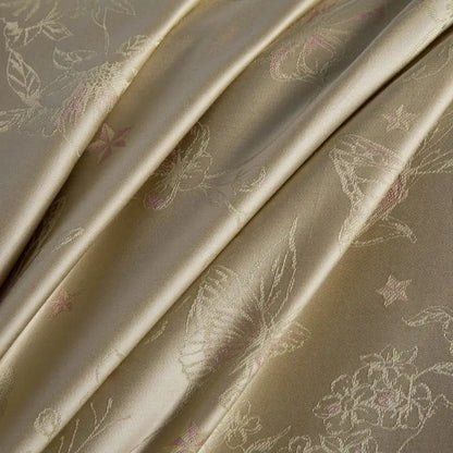 Beige and gold butterfly lyocell cotton bedding set with delicate satin floral and star motifs by decorbites butterfly jacquard