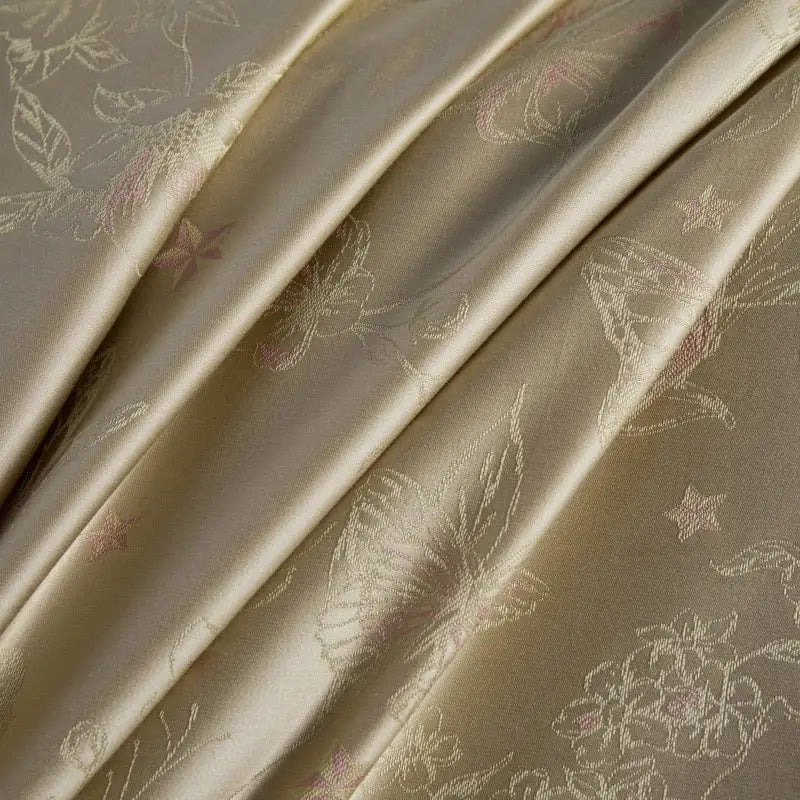 Beige and gold butterfly lyocell cotton bedding set with delicate satin floral and star motifs by decorbites butterfly jacquard