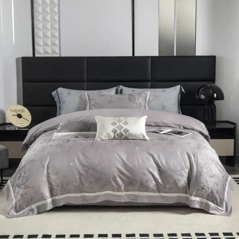 A soft gray satin duvet cover with subtle floral pattern and white piping in beige and gold decorbites butterfly jacquard lyocell cotton bedding set