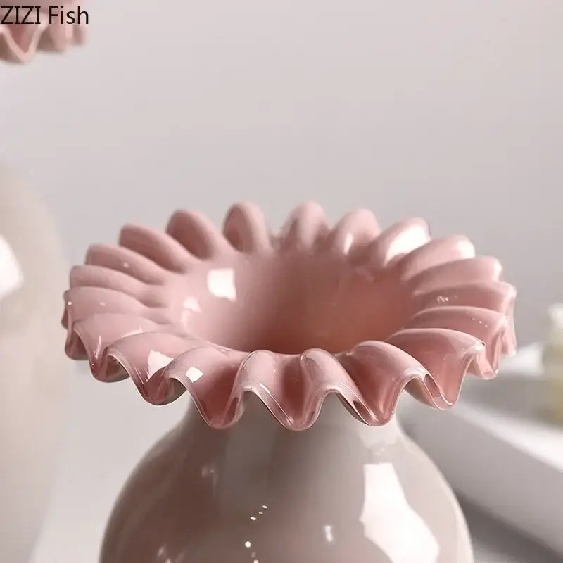A glossy pink ceramic vase with a pink flower edge and fluted petal-like rim for living room decor