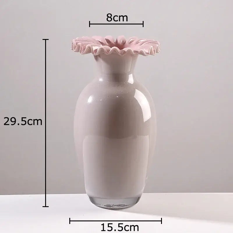 A sleek blush-pink ceramic vase with a pink flower edge rim and clear glass base for living room decor