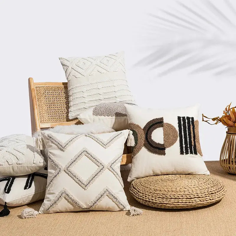 Beige cushion cover with decorbites geometric embroidery and tassels in neutral tones for living room decor