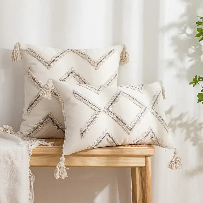 Cream-colored cushion cover with decorbites geometric embroidery tassel patterns in beige and white for living room decor
