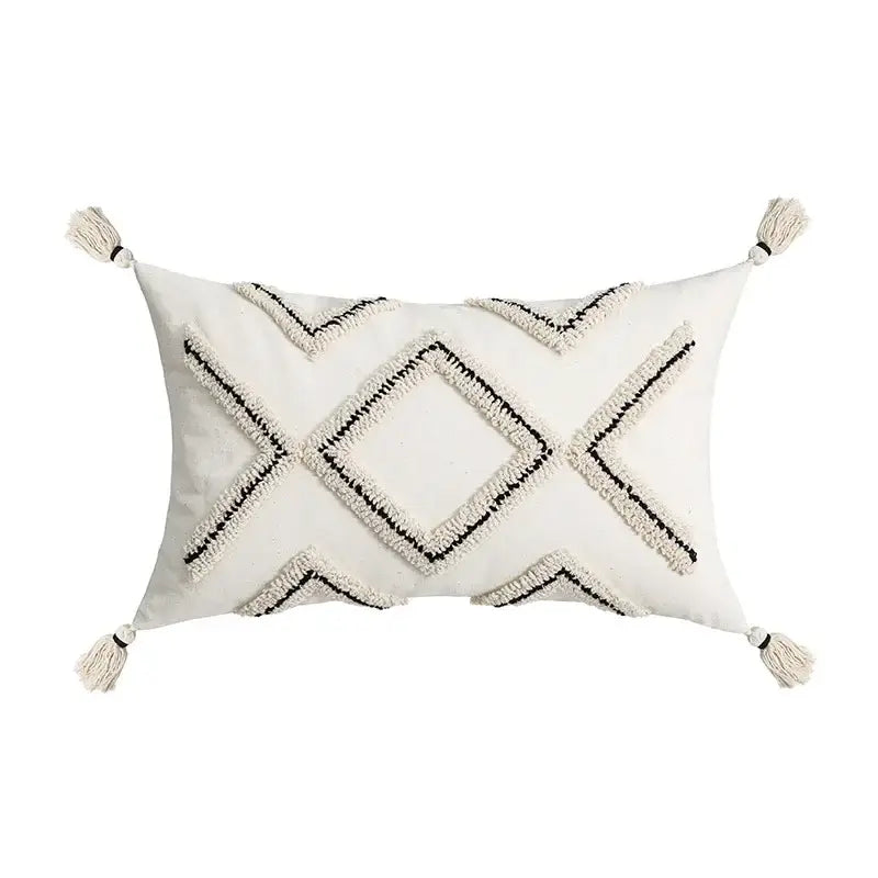 Cream-colored rectangular cushion cover with black decorbites geometric embroidery and tassels for living room decor