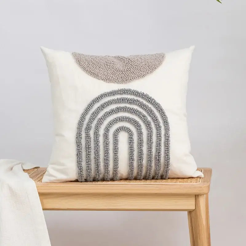 Beige and white cushion cover with cream color and gray tufted yarn decorbites geometric embroidery tassel design