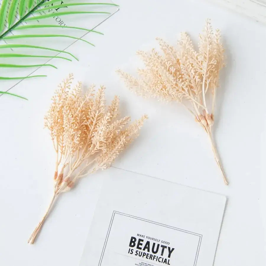 Two beige dried faux fern sprigs with feathery fronds as decorbites golden wheat ear artificial plants for living room decor