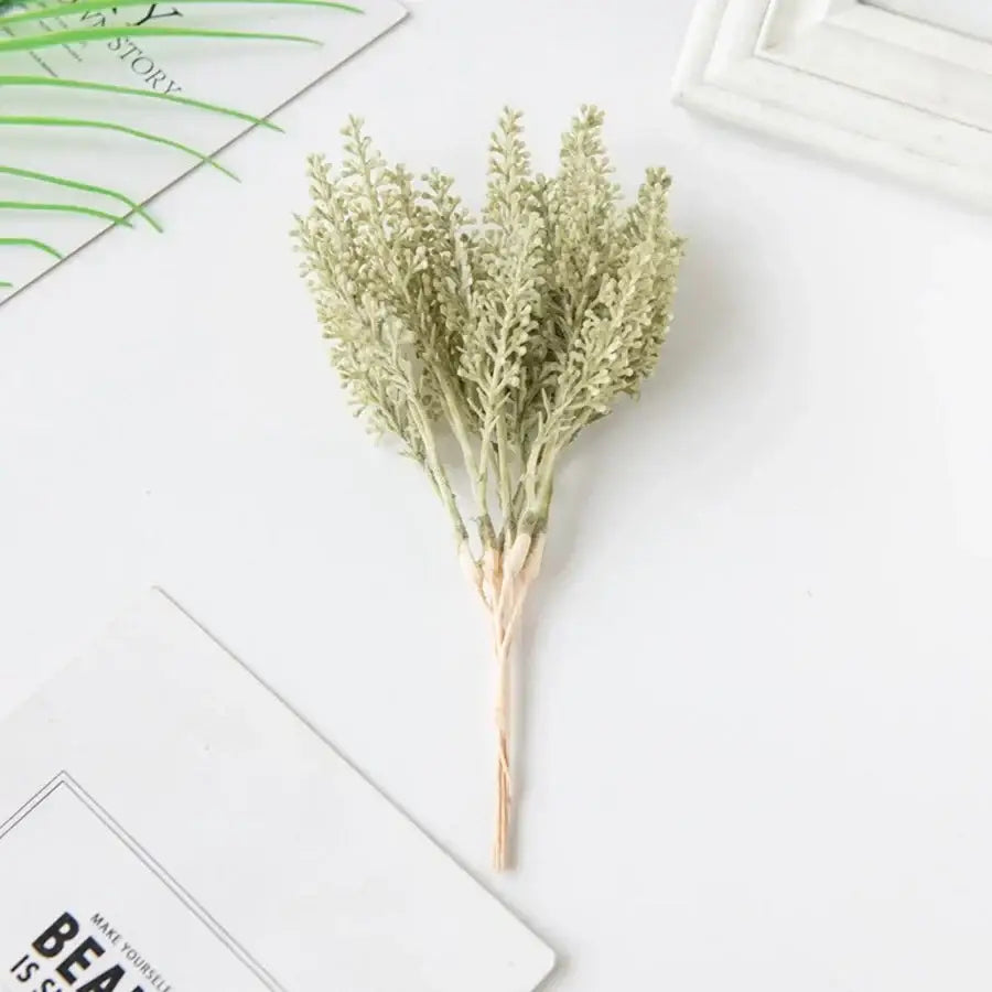 A delicate pale green artificial plant with feathery foliage and slender stems for decorbites golden wheat ear decor