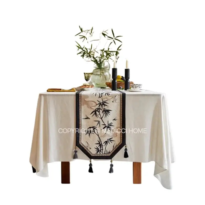 Beige table runner with black bamboo leaf swallow print embroidery and tassels for decorbites dining room decor