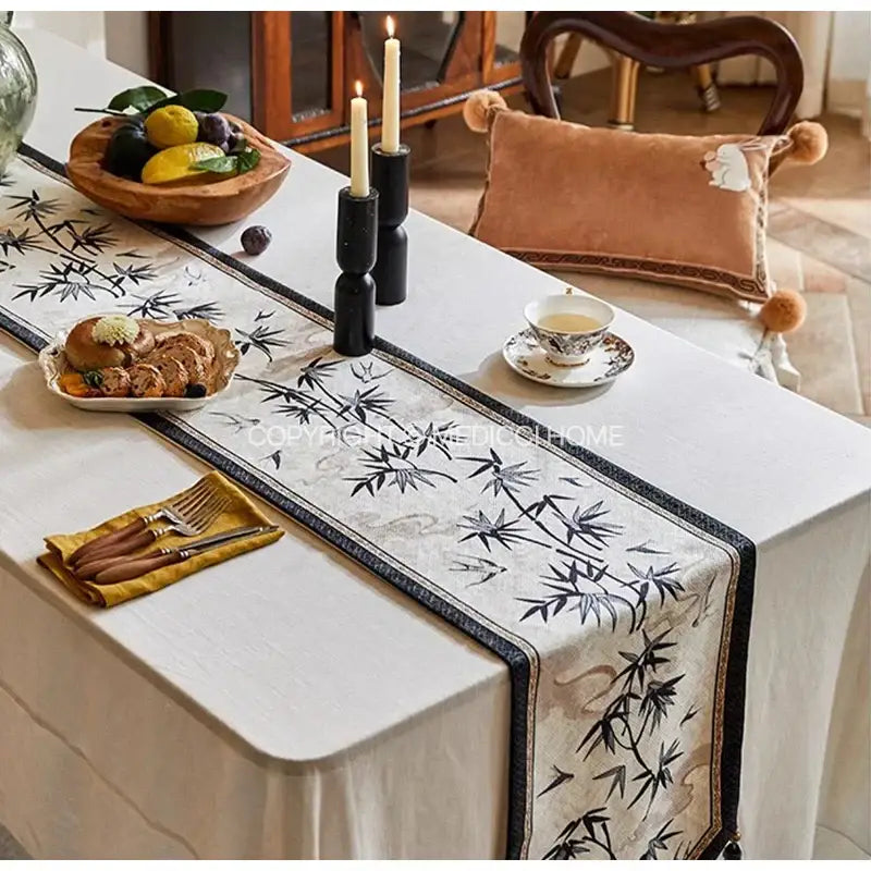 Elegant beige table runner with black bamboo leaf swallow print embroidery and dark border for dining room decorbites decor