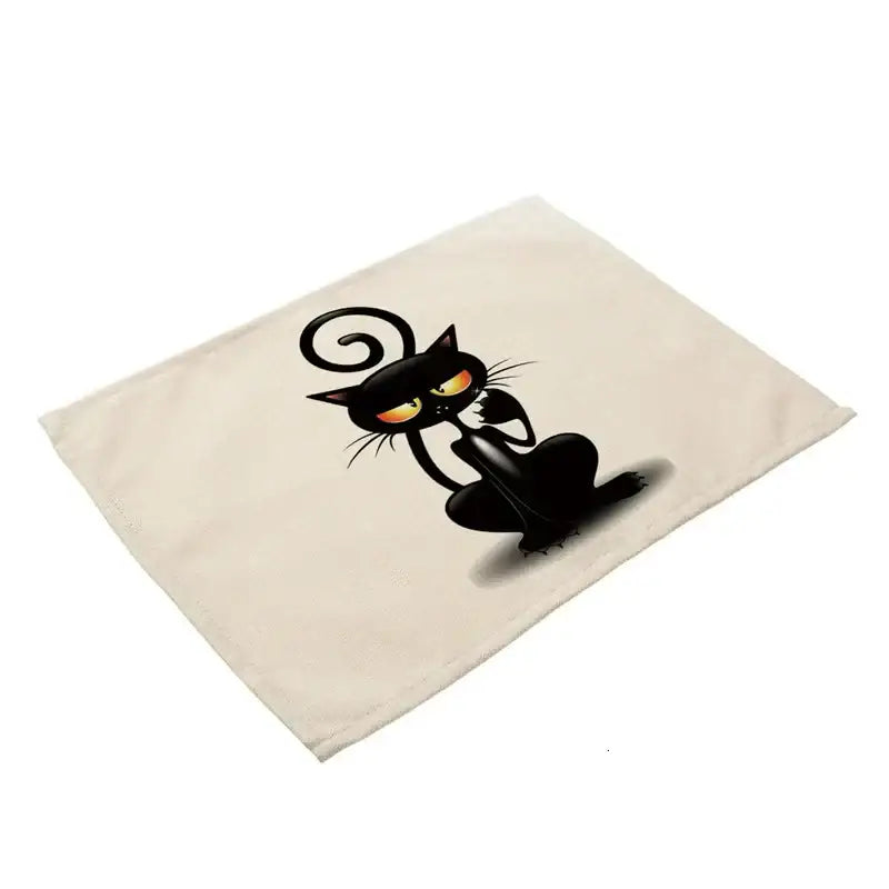 Cream-colored canvas cat linen placemat featuring a decorbites black cat with glowing orange eyes and curled tail for dining table decor