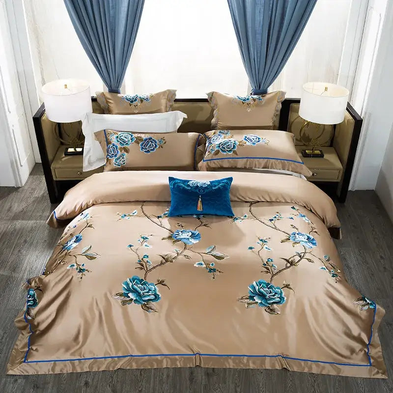 Beige satin bedding set with blue floral embroidered egyptian cotton and royal blue velvet accent pillow for luxury bedroom