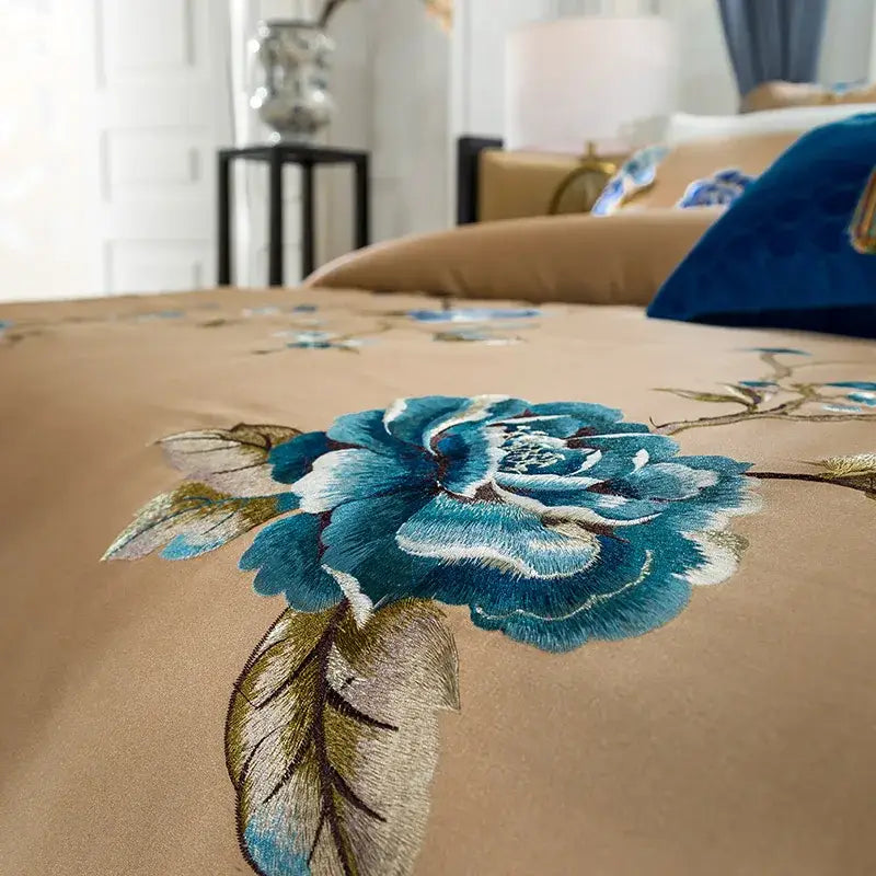 Beige and blue embroidered egyptian cotton bedding set with intricate teal and gold peony flower embroidery