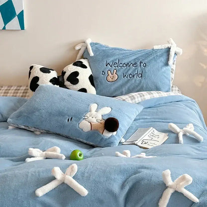 Blue plush bedding set featuring embroidered bunny and welcome to world design in beige and blue velvet duvet bedding
