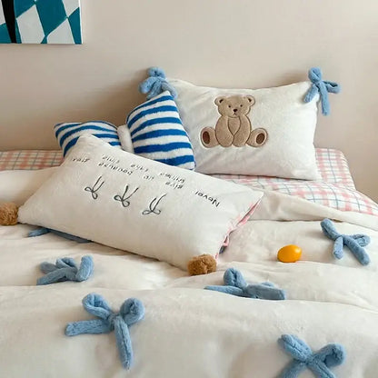 Beige and blue embroidered velvet duvet bedding set featuring a white plush pillow with brown teddy bear and blue bow ties