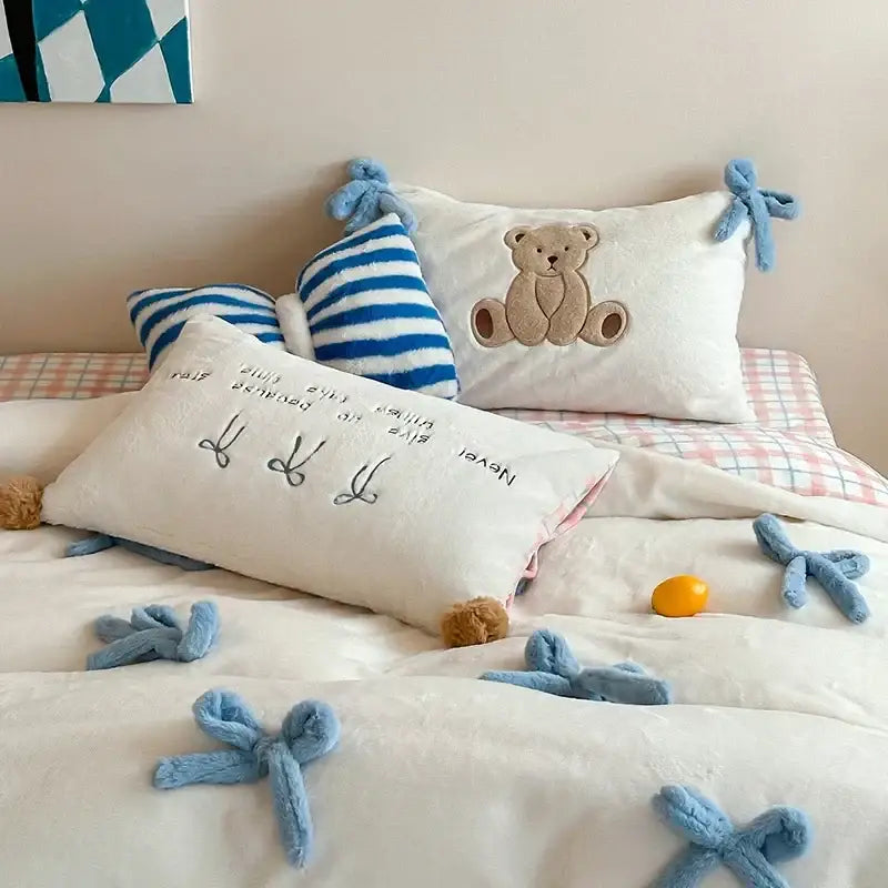 Beige and blue embroidered velvet duvet bedding set featuring a white plush pillow with brown teddy bear and blue bow ties