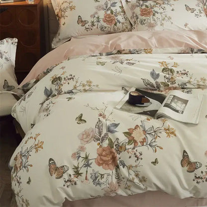 Beige and blush butterfly blooming flowers bedding set with cream floral satin fabric and delicate pink peach green blossoms