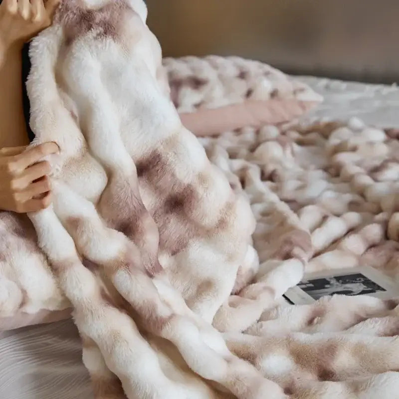 A beige and brown decorbites cozy fleece faux fur throw blanket with chunky knit texture for bedroom decor
