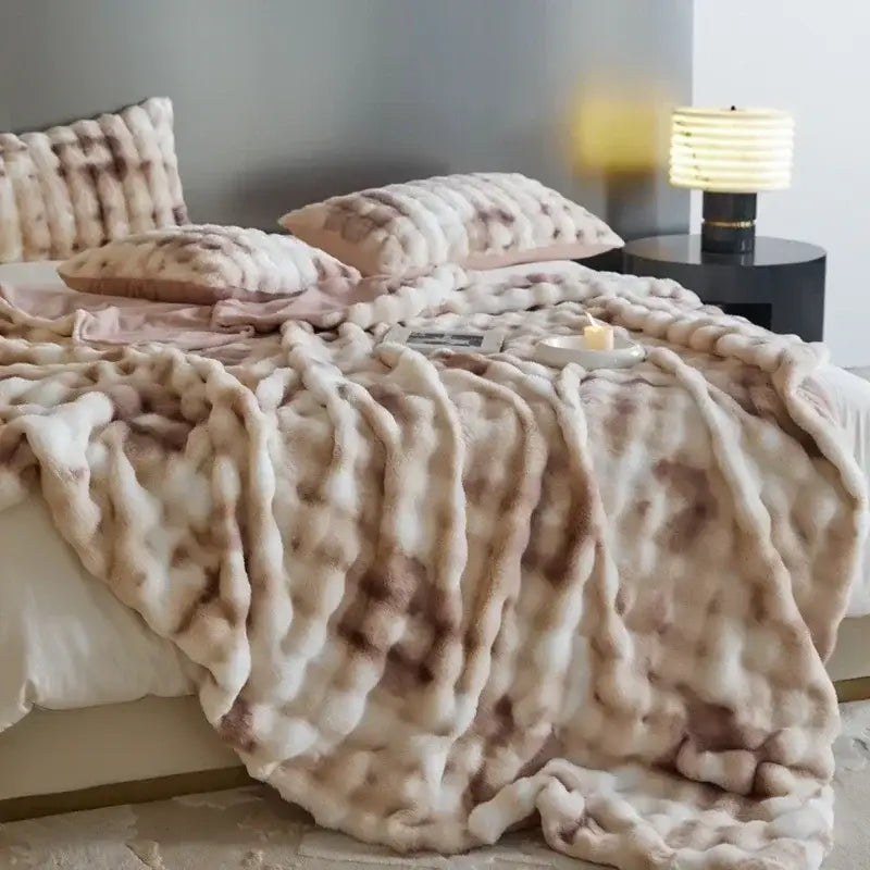 A decorbites cozy fleece beige and brown faux fur throw blanket with a chunky textured weave for bedroom decor