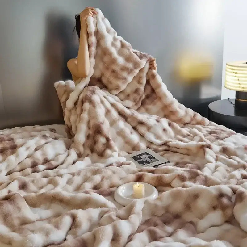 A beige and brown mottled faux fur decorbites cozy fleece throw blanket ideal for bedroom comfort and decor