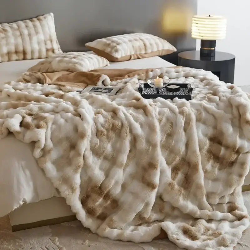 Beige and brown faux fur decorbites cozy fleece throw blanket with a plush textured surface for bedroom use
