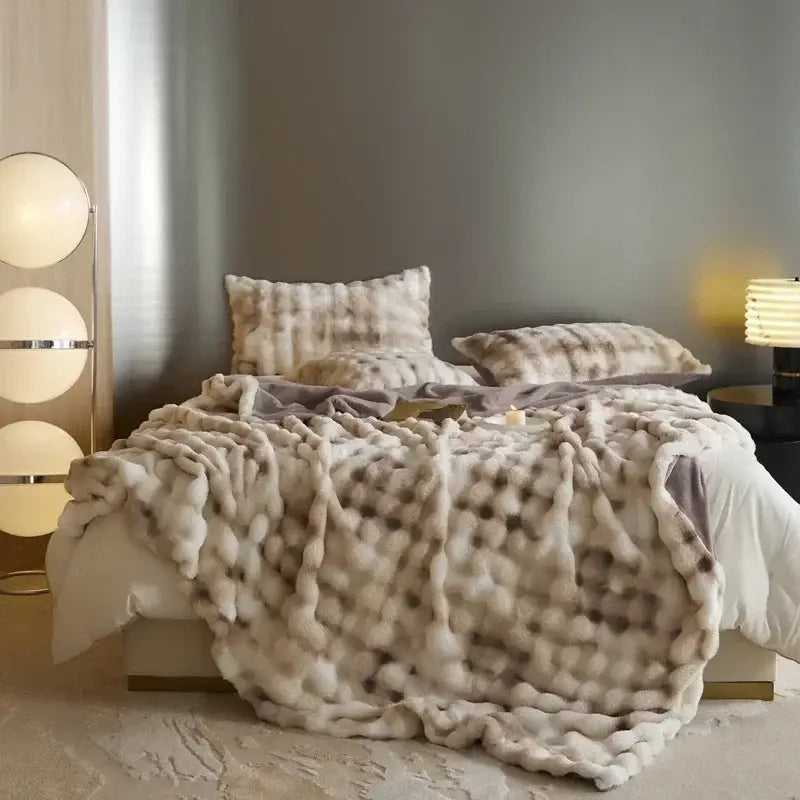 Beige and brown faux fur decorbites cozy fleece throw blanket with cream chunky knit and gray speckles textured surface