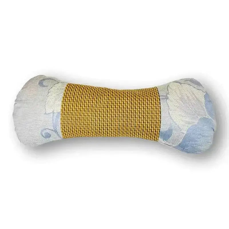 A beige and brown floral woven cooling neck pillow with a plush bone-shaped toy featuring a gold band