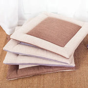Stacked beige and brown decorbites linen seat cushions feature a non-slip design with soft linen fabric for dining room chairs