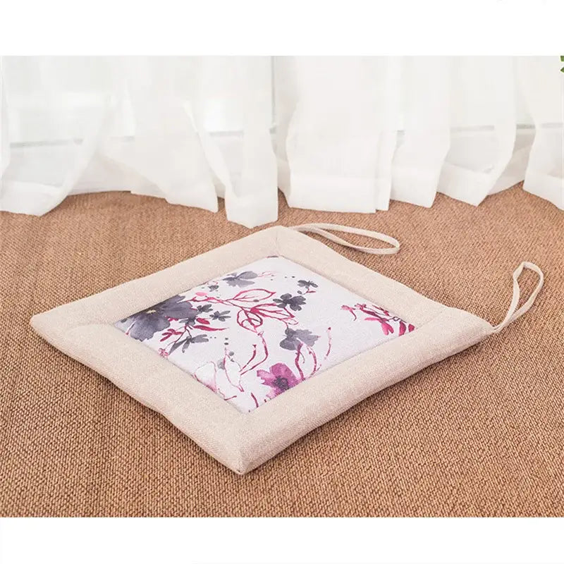 Beige and brown decorbites linen seat cushion with delicate purple floral panel and fabric ties non slip design