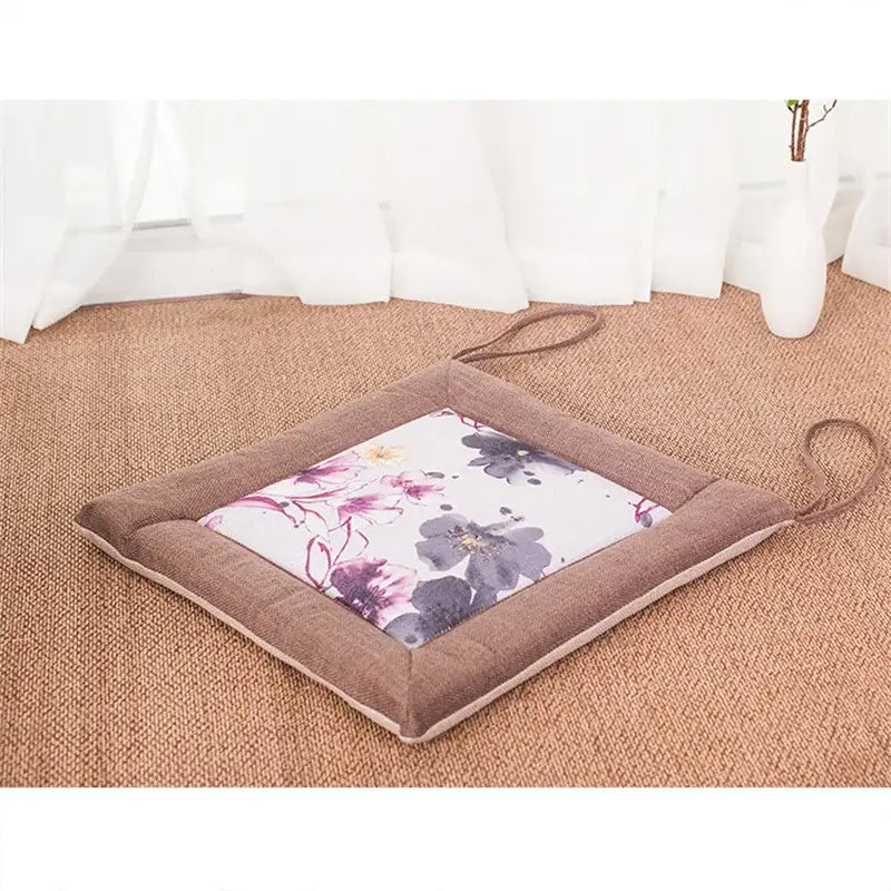 Beige and brown decorbites linen seat cushion with non-slip backing featuring purple and gray floral patterns for dining chair