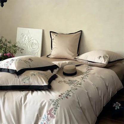 Beige butterfly flowers bedding set with delicate floral embroidery and black piping in decorbites 1000tc cotton material