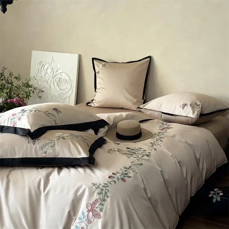 Beige butterfly flowers bedding set with delicate floral embroidery and black piping in decorbites 1000tc cotton material