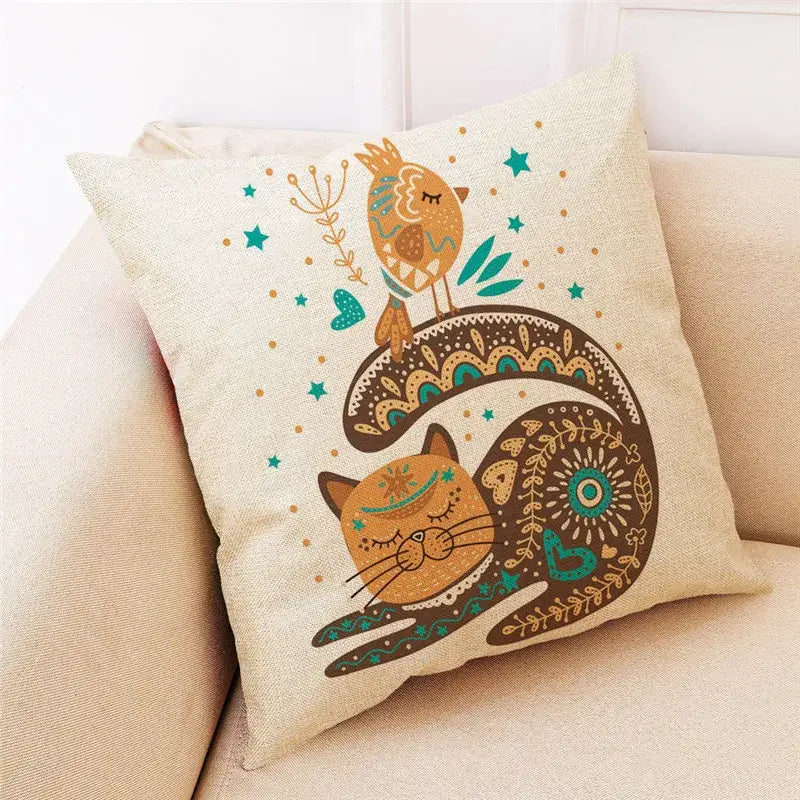 Beige cartoon cat linen throw pillow featuring an orange cat with intricate patterns beside a stylized bird decorbites cartoon cat