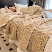 Beige carved velvet warmth blanket with textured geometric pattern and soft white inner lining for plush decorbites throw