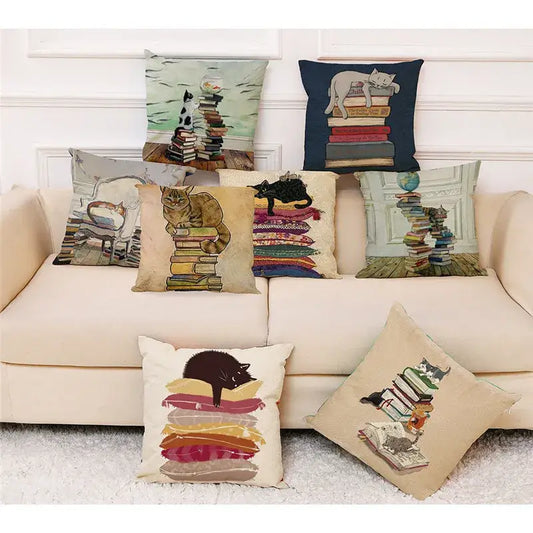 Beige cushion cover with black cat lounging on colorful stacked books pillow case 45x45cm decorbites creative cat