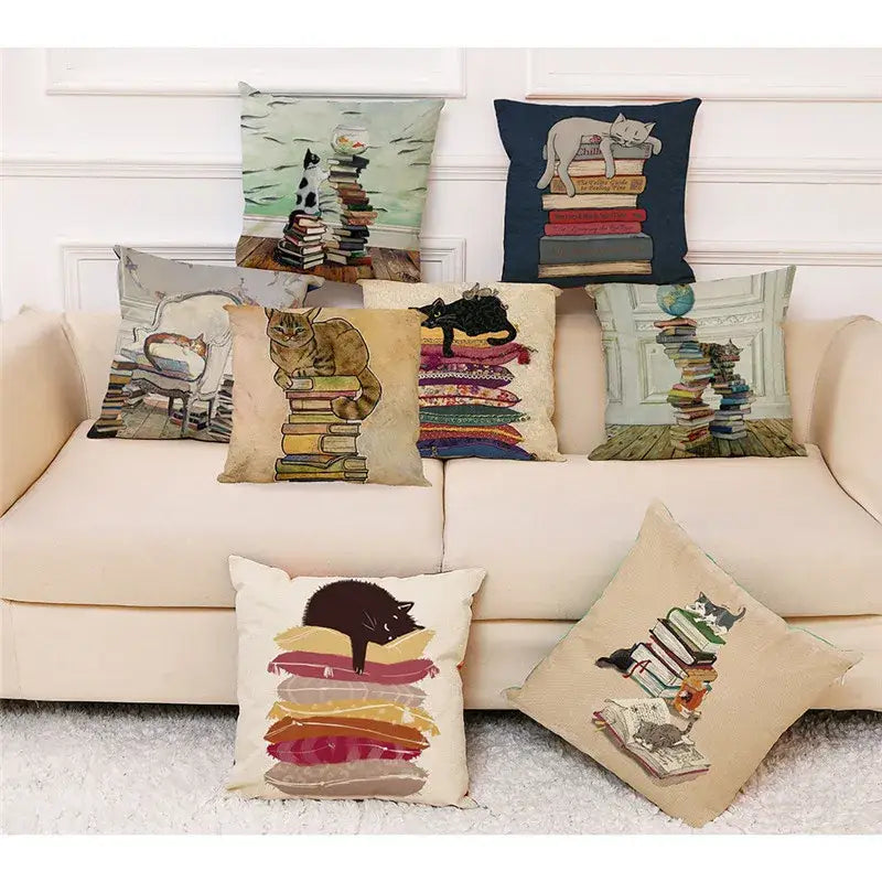 Beige cushion cover with black cat lounging on colorful stacked books pillow case 45x45cm decorbites creative cat