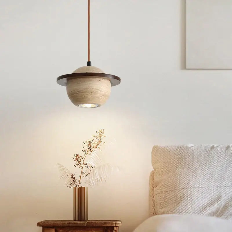 A modern beige cave stone led pendant light with textured globe and dark bronze ring accent for living room decorbites cave stone