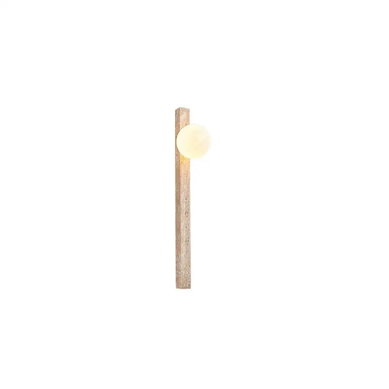 Minimalist beige cave stone wall lamp with warm glowing bulb on textured wooden post for living room decorbites cave stone