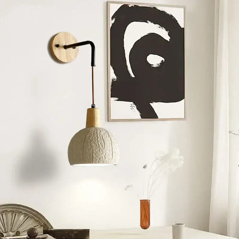 Beige cement shade wood wall sconce with textured off-white ceramic pendant lamp and black metal arm for bedroom decorbites decor