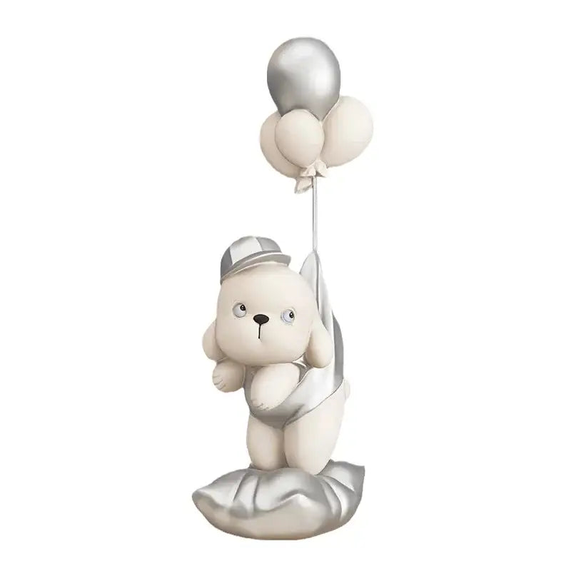 A beige ceramic balloon puppy statue with cream plush finish holding silver and off-white balloons for living room decor
