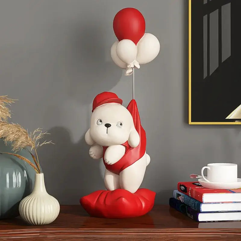 Beige ceramic balloon puppy statue featuring a white puppy figurine with red hat and balloons for living room decor