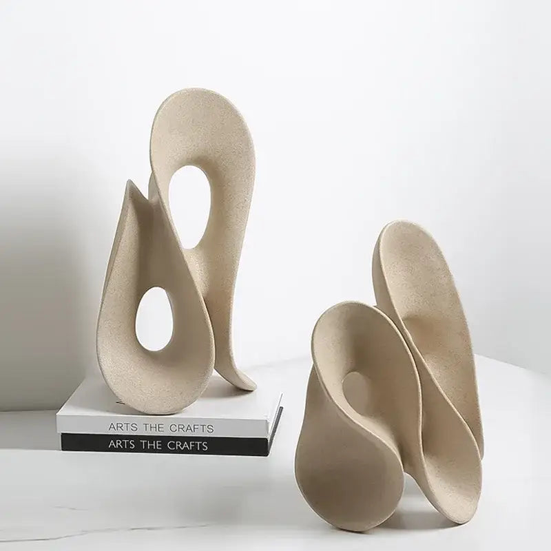 Beige ceramic coral hollow sculpture with smooth flowing curves by decorbites for living room abstract decor